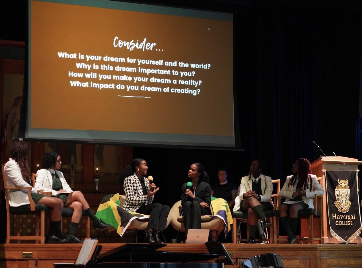 Havergal's Black Student Affinity Grads on the podium with Justice and Niath faith as they present.