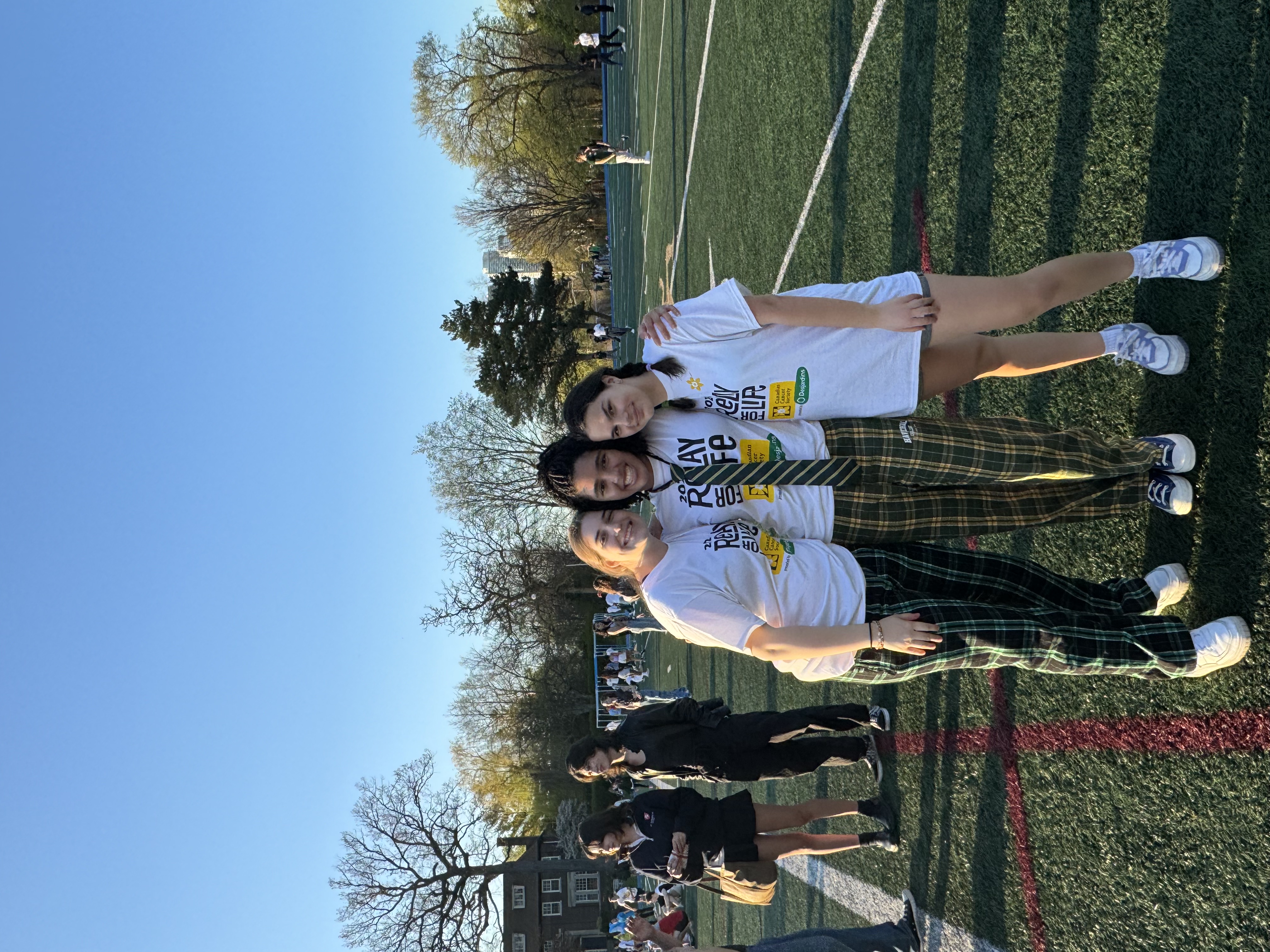 Chloe and her two friends taking a picture at the 2024 COSSOT Relay for Life event held at Upper Canada College.